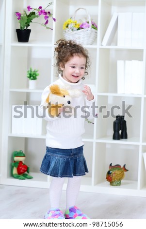 smiling little girl with toy