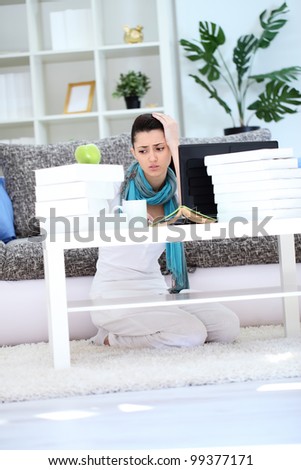 Stressed female student learning at home
