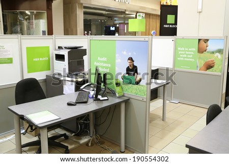 Burnaby BC Canada - April 28 2014 : H&R Block is a tax preparation company in the United States, claiming more than 24.5 million tax returns prepared worldwide. Small office inside mall.