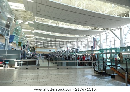 Vancouver, BC Canada - September 13,  2014 : One side of the Vancouver International Airport lobby with blur motion people in Vancouver BC Canada.
