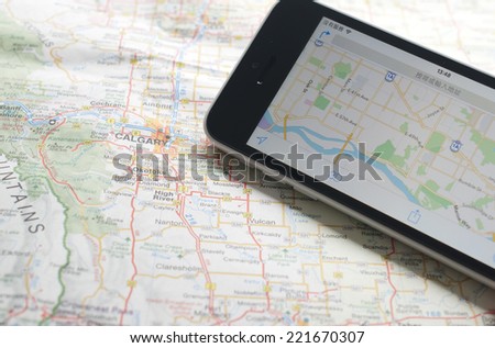 Smartphone with GPS navigator on map