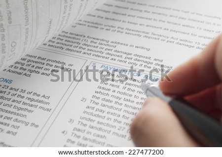 Pen pointing about payment of rent