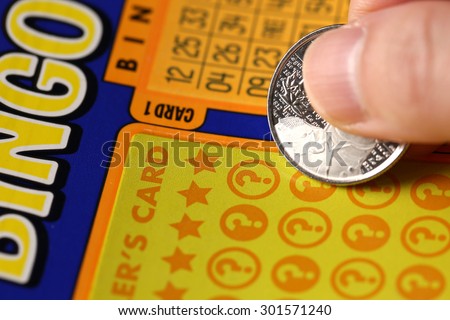 Coquitlam BC Canada - June 02, 2015 : Woman scratching lottery tickets. The British Columbia Lottery Corporation has provided government sanctioned lottery games in British Columbia since 1985.
