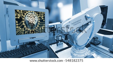 Machine learning and artificial intelligence concept. Computer display illustrative screen and blue tone of automate wireless Robot arm in smart factory background