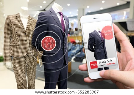 smart retail marketing concept. Hand holding smart phone and application to check number of social media like and sale price in retail fashion shop