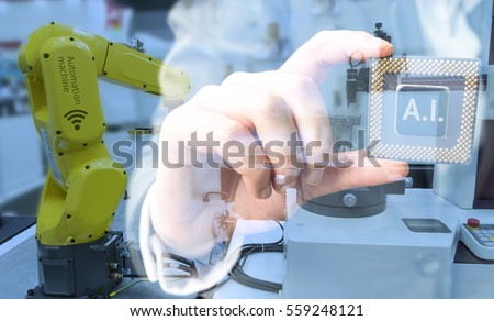 Industry 4.0 , Machine learning and artificial intelligence concept. Man suit hand holding Ai chipsets and blue tone of automate wireless Robot arm in smart factory background