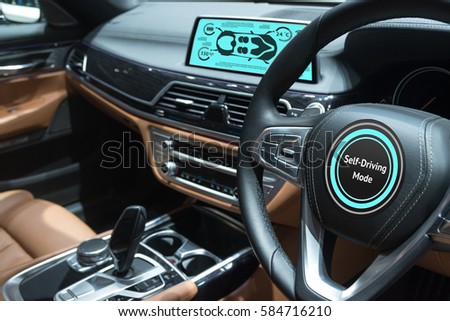 Smart car (HUD) concept. Empty cockpit in vehicle and Self-Driving mode car screen .