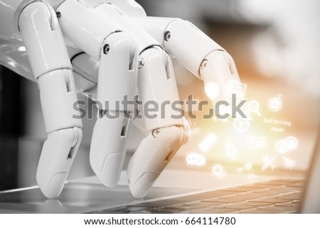 Chatbot , artificial intelligence , robo advisor , robotic concept. Robot finger point to laptop button and infographic icons with flare light effect.