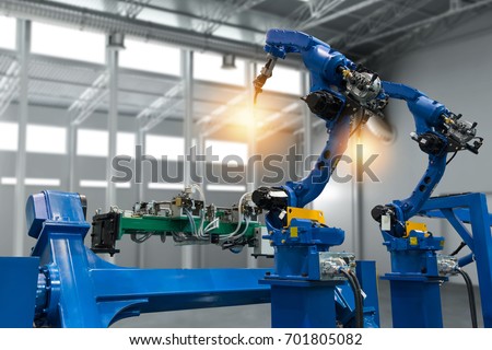 Automobile manufacturing production industrial machine , factory robot arm in smart factory and industry 4.0 concept.