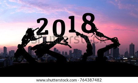 2018 years of ai technology , industry 4.0 , artificial intelligence trend concept. Silhouette of automation robot arms. Blur metropolis city building background.