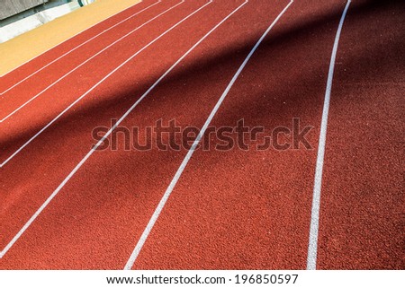 Line on running track with rubber cover