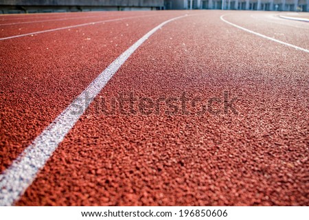 Line on running track with rubber cover