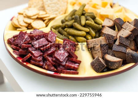 Full plate of snacks on white table