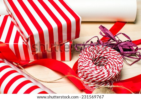 Christmas preparation. Ribbons and accessories for Xmas gift packing on wood floor