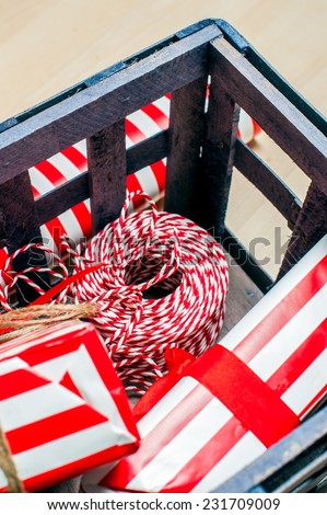 Christmas preparation. Accessories for Xmas gift packing in wood box, vertical image