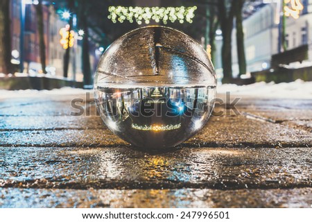 Creative image of night city lights. Kaunas City Lights in Crystal ball.