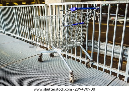 Shopping cart on underground parking in supermarket