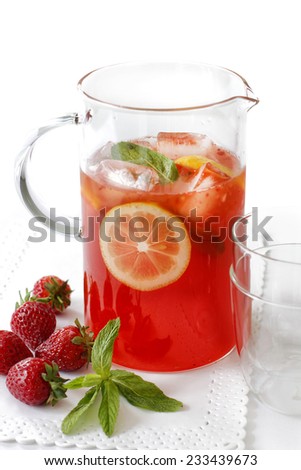 Cold strawberry drink with fresh strawberries