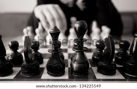 black and white chess concept with man make move