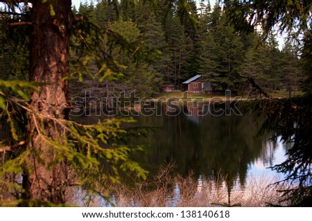 bulgarian forest resort with lake and wooden house
