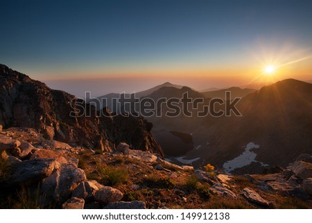 sunrise over the Ice lake in bulgarian Rila mountain- view from Musala peak