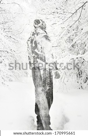 Abstract black and white double exposure man in winter forest