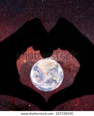 love planet concept with human hands- elements of this image are furnished by NASA