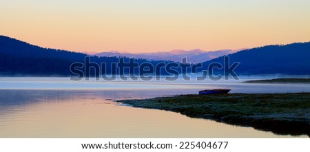 high mountain lake in morning sunrise panoramic landscape