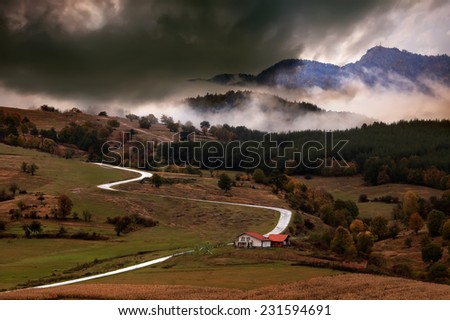 HDR misty landscape  over the mountain country road in bulgarian Rhodope mountain