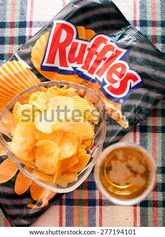 SOFIA, BULGARIA - May 11, 2015: 8.5 oz packet of RUFFLES brand cheddar and sour cream flavored potato chips