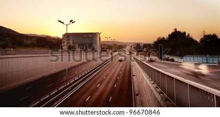 Panoramic city landscape in sunset time; Night HDR car traffic
