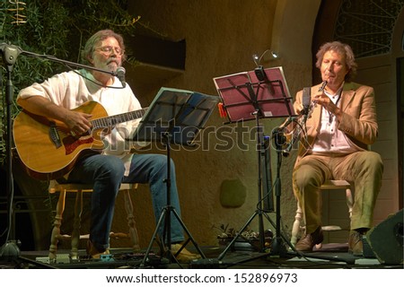 ERBUSCO,ITALY - AUGUST 30:  exhibition live of  guitar player Giorgio Cordini and the player of wind instruments Mario Arcari  at event \