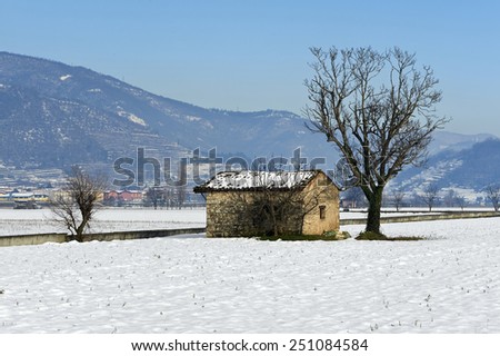 Rodengo (Bs),Franciacorta,Italy,a rural farm building for storing farm equipment in snow country