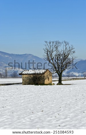 Rodengo (Bs),Franciacorta,Italy,a rural farm building for storing farm equipment in snow country