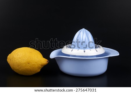 a lemon squeezer on a black backgruond