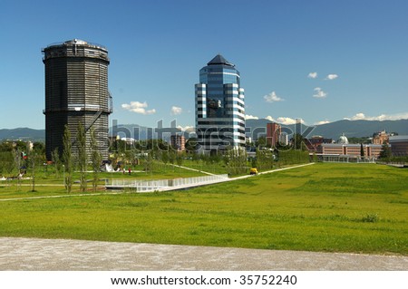 Brescia,Lombardy,Italy,commercial building and public park with gasometer building