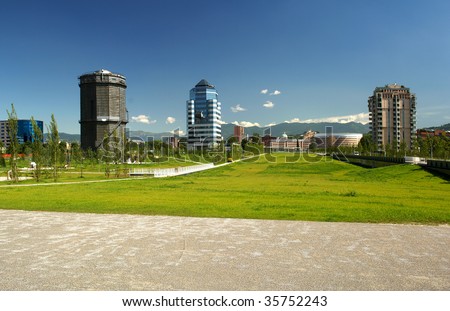 Brescia,Lombardy,Italy,commercial building and public park with gasometer building