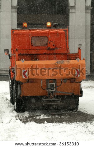 a municipal car for sprinkle half the salt and sand on roads with snow