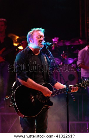 OSPITALETTO, ITALY - JULY 25 : Italian pop singer Umberto Tozzi performs during live concert on July 25, 2003 in Ospitaletto, Italy.