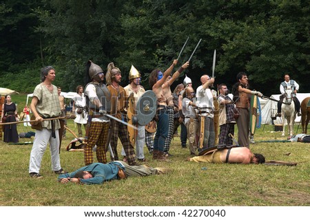 BRESCIA, ITALY - JULY 13 : Participants in a \'battle\' action between Roman and Celtic army at the celebration of the Celtic Day July 13, 2008 in Brescia, Italy