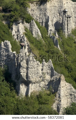 Zone (BS),Italy,  Nature Reserve of the Pyramids of Zone of erosion, the earth\'s pyramids topped by large hats rock,originated by the erosive action on the original deposit moraine