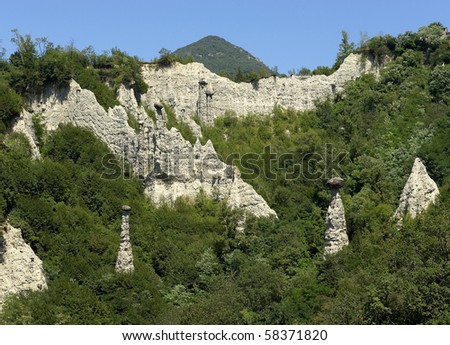 Zone (BS),Italy,  Nature Reserve of the Pyramids of Zone of erosion, the earth\'s pyramids topped by large hats rock,originated by the erosive action on the original deposit moraine