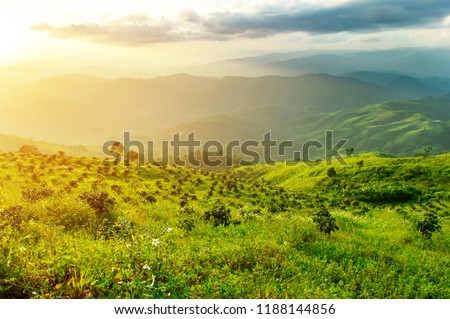 High mountain landscape, the beauty of nature. The sun sets and the sky filled with clouds.