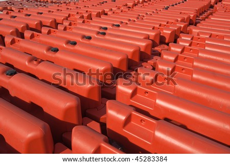 Orange road security barriers lined up