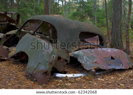 stock photo Rusted cars Detail from the Junkyard