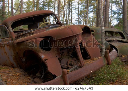 stock photo Rusted cars Detail from the Junkyard