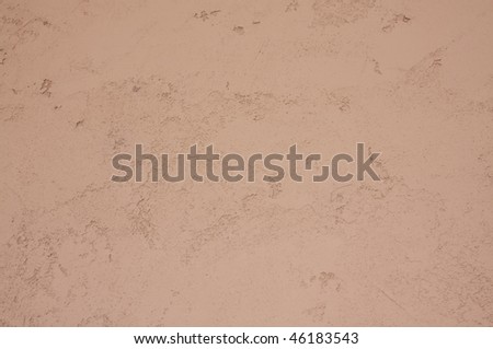Abstract peach colored stucco textured background
