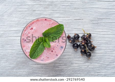 Fresh smoothies on wooden background with fresh mint . Top view.