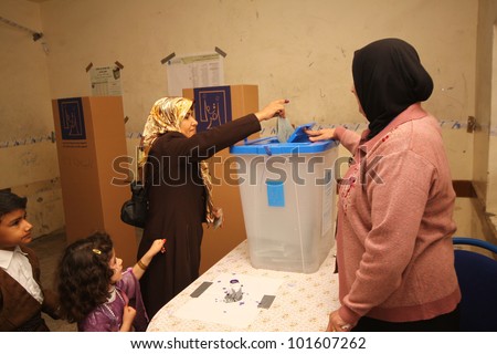 ARBIL - MARCH 07: Kurds flee to election centers to vote for the Iraqi General Elections on March 7, 2010 in the capital of Kurdistan, Arbil, Iraq