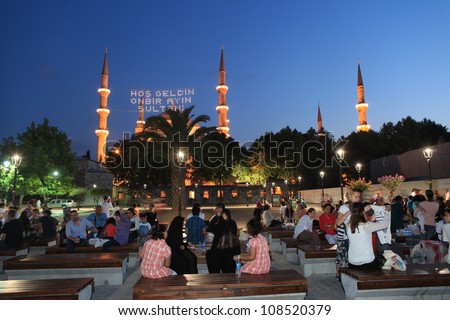 ISTANBUL, TURKEY- JULY 20: Breaking of the fast opening of Turkish Muslims in Sultanahmet Square on July 20, 2012 in Istanbul,Turkey